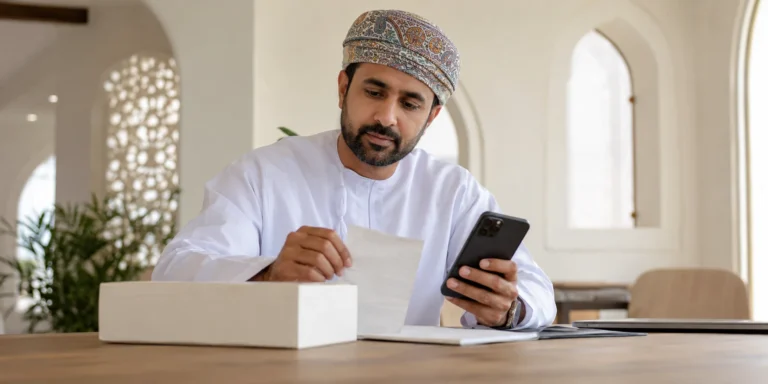 Consumer preparing evidence for a complaint in Oman